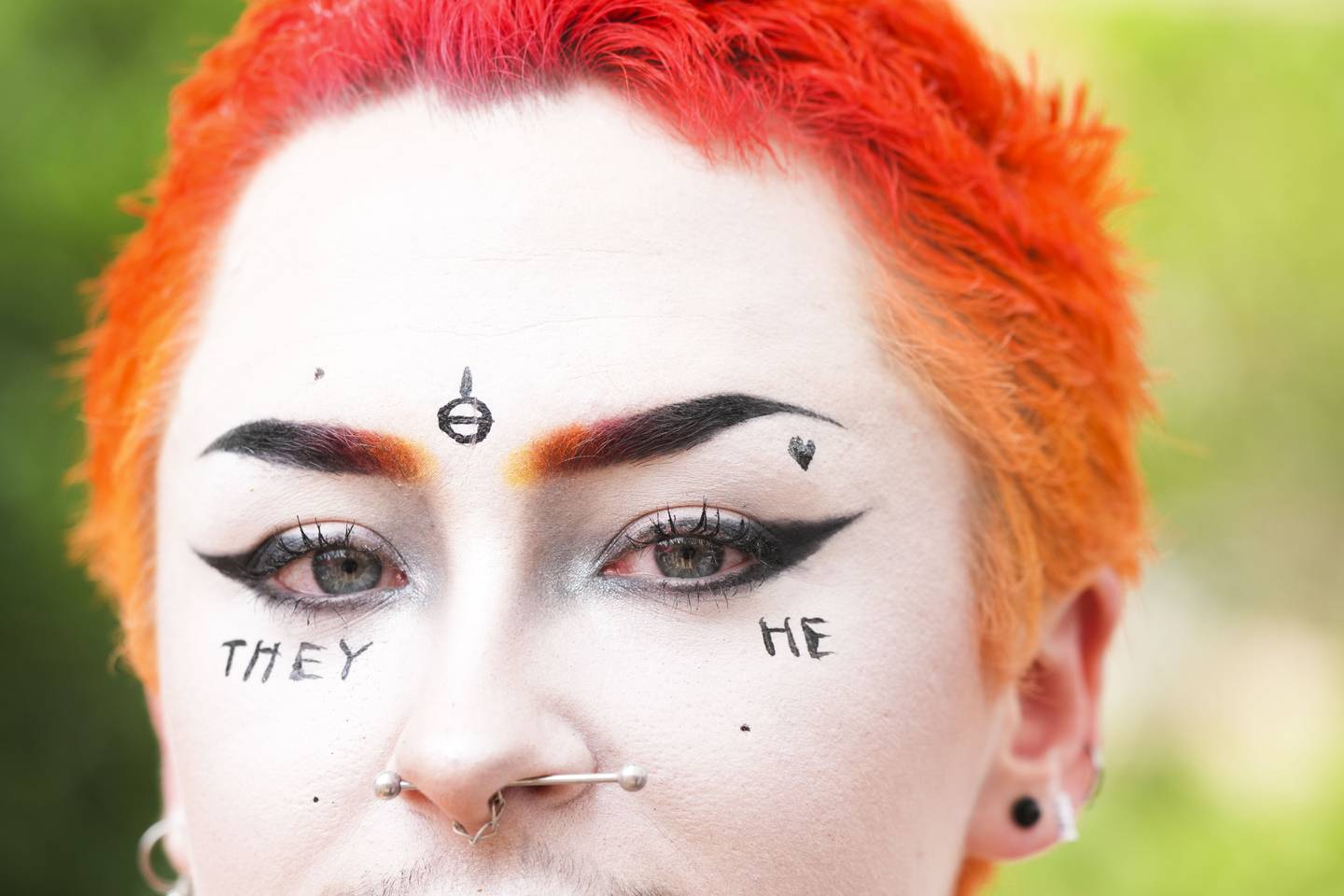 Spencer Stockton, 22, shows of makeup featuring their preferred pronouns at Annapolis Pride parade and festival on June 3, 2023.