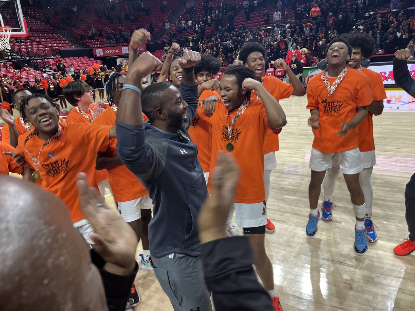 City boys basketball Omarr Smith does a flex pose before receiving the Class 3A state championship trophy Thursday evening. The No. 3 Knights won their first title since 2014 with a 67-54 victory over Damascus at the University of Maryland.