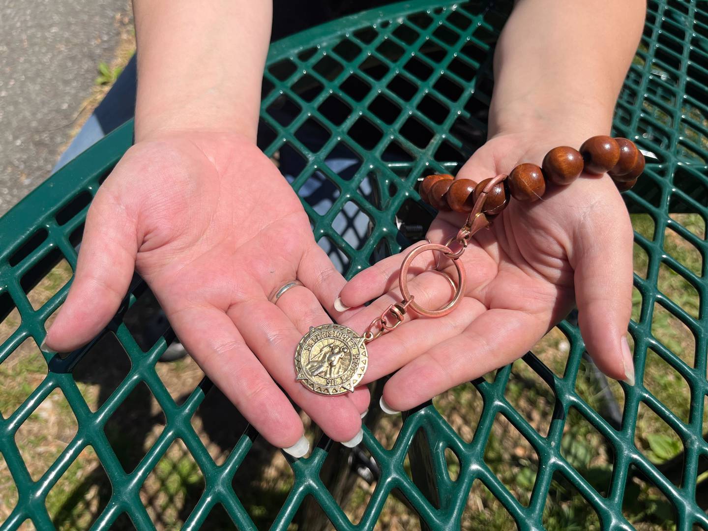 Ann Zelenka keeps a St. Christopher rosary bracelet with her often after a friend gave it to her when she was going through a tough time. Catholicism is a decision-making tool for her life, she said.