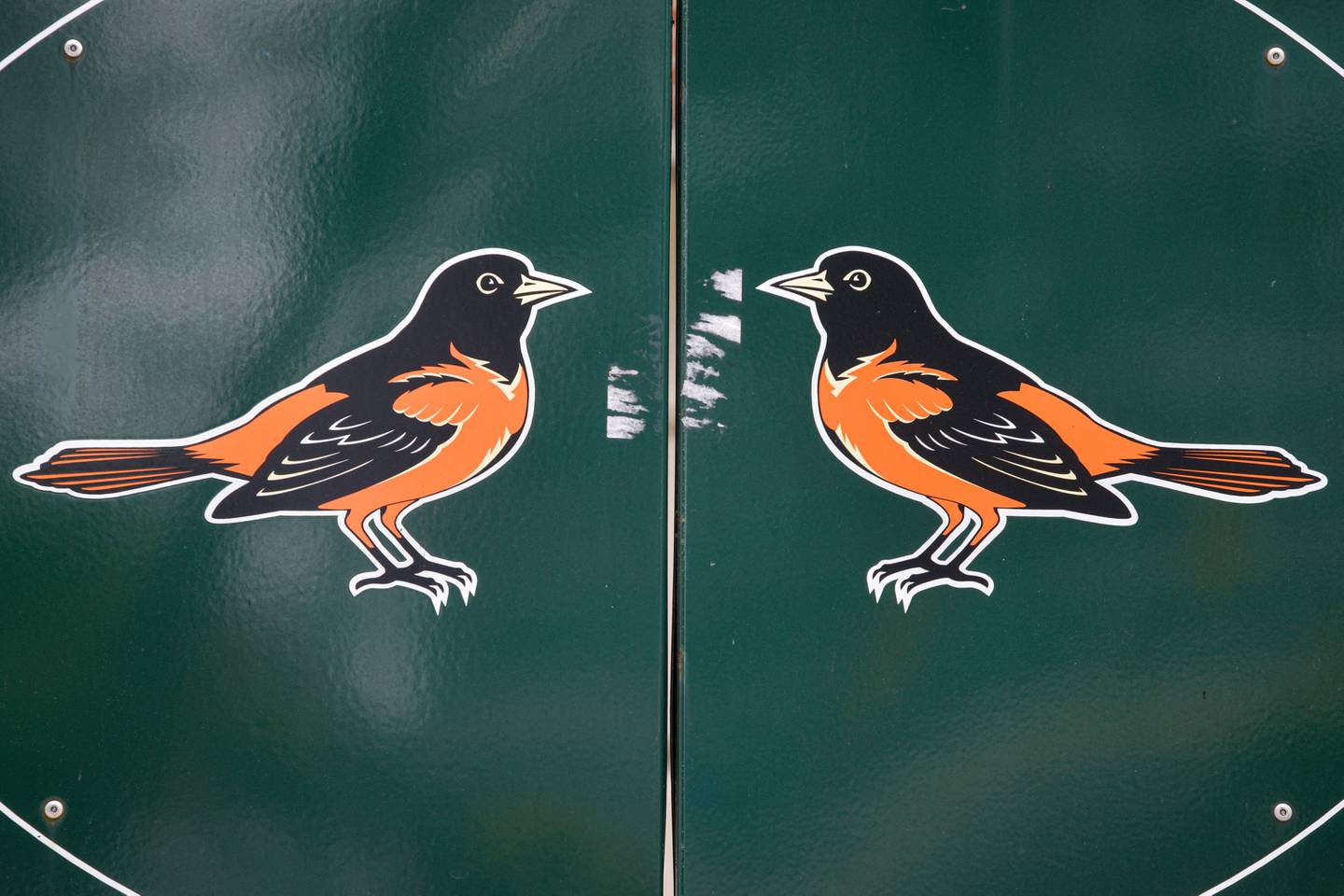 Baltimore Orioles logos are painted on an exterior gate of Oriole Park at Camden Yards in South Baltimore.