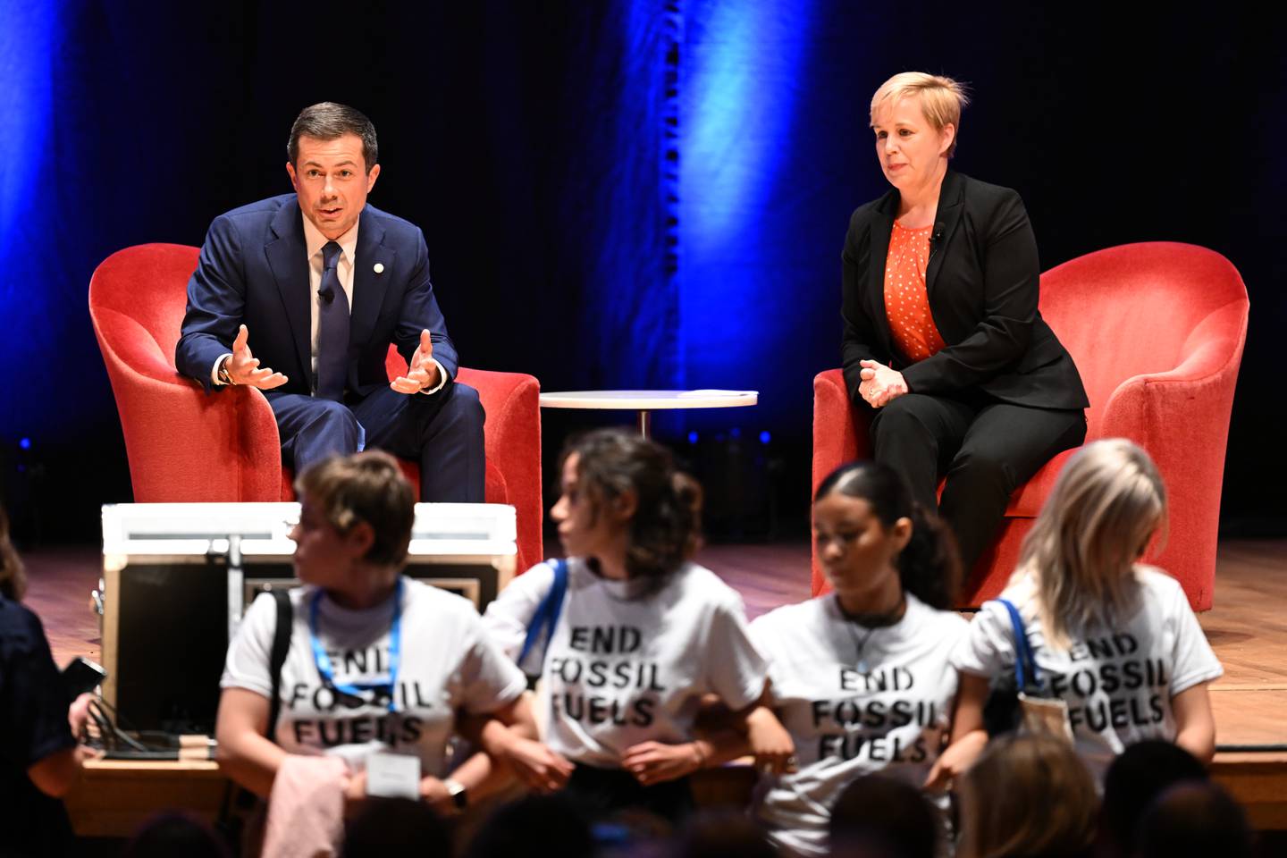 A group of protestors from Climate Defiance interrupted a discussion with Secretary of Transportation Pete Buttigieg at iMPACT Maryland, a thought leadership conference hosted by The Baltimore Banner on Tuesday, Oct.10, 2023, in Baltimore.