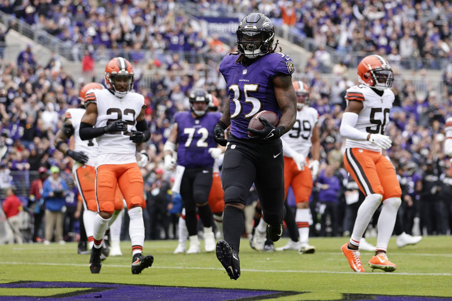 Baltimore Ravens running back Gus Edwards (35) scores a touchdown on a 7 yard run during the second quarter against the Cleveland Browns in an NFL football game, Sunday, Oct. 23, 2022, in Baltimore.