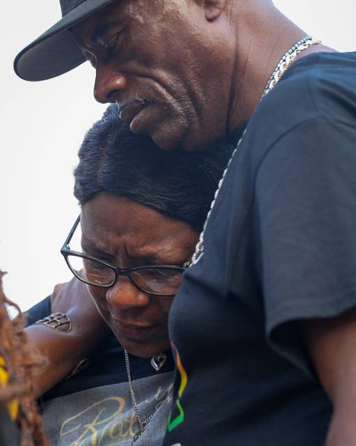 Nicole Pettiford, left, is comforted by Cephus ‘Uncle Bobby’ Johnson during a West Wednesday rally in Waverly on July 19, 2023. Tawanda Jones’ brother, Tyrone West, was killed by police in 2013, and she’s been searching for justice and accountability at these public rallies every week since then.