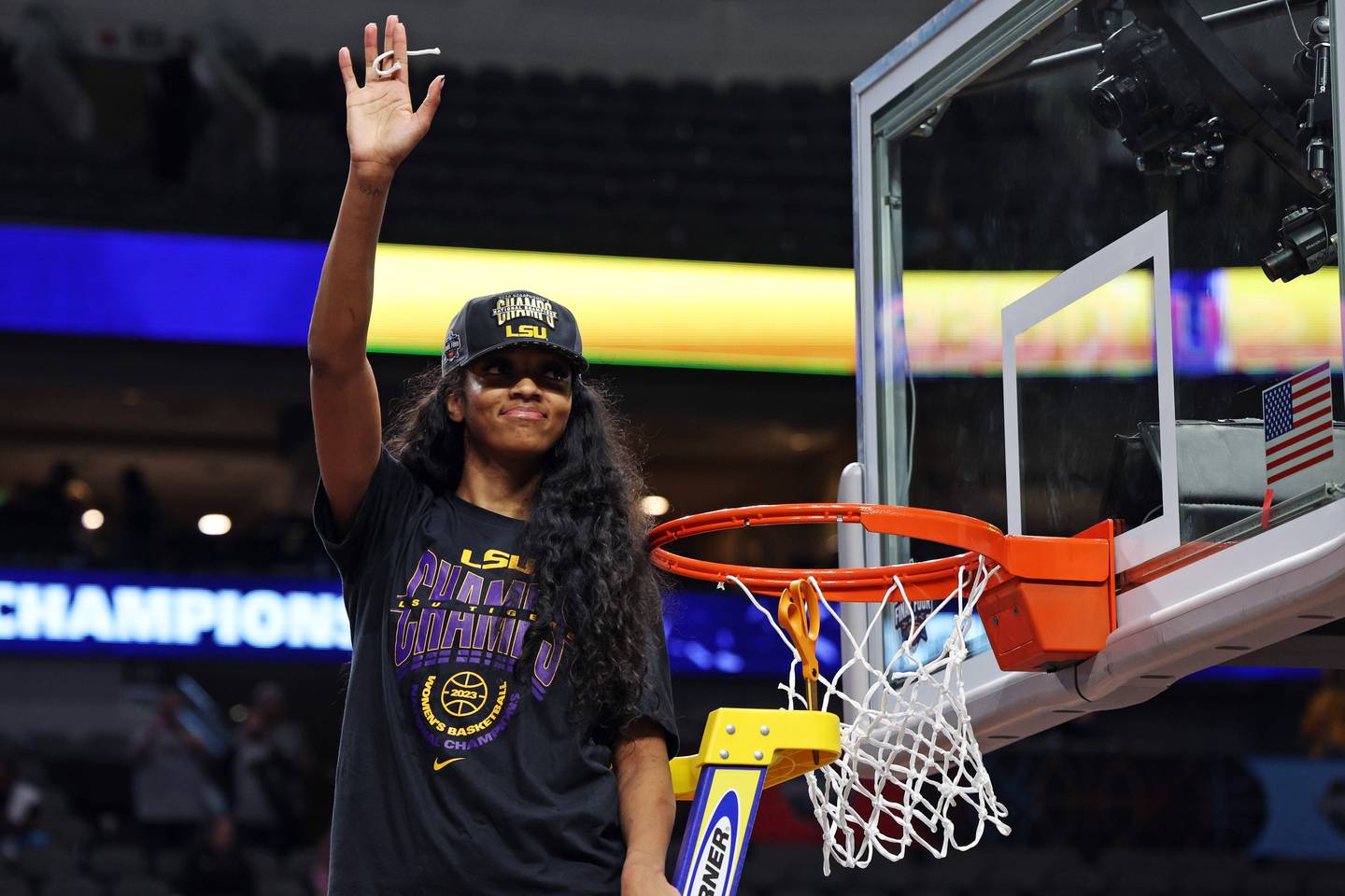 DALLAS, TEXAS - APRIL 02: Angel Reese #10 of the LSU Lady Tigers cuts down a piece of the net after defeating the Iowa Hawkeyes 102-85 during the 2023 NCAA Women's Basketball Tournament championship game at American Airlines Center on April 02, 2023 in Dallas, Texas.