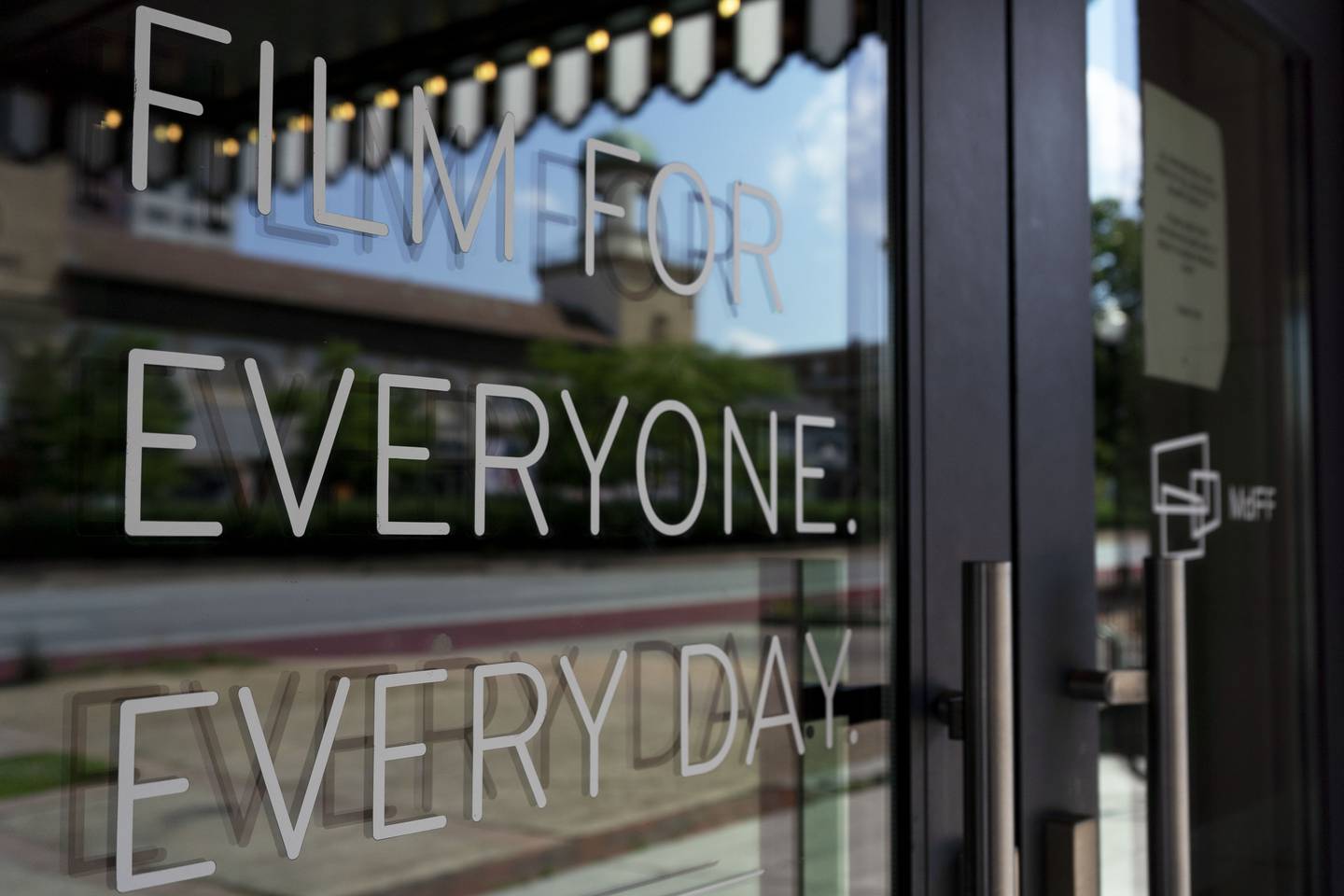 A sign on the door of Parkway Theatre that reads: "Film for everyone. Every day."