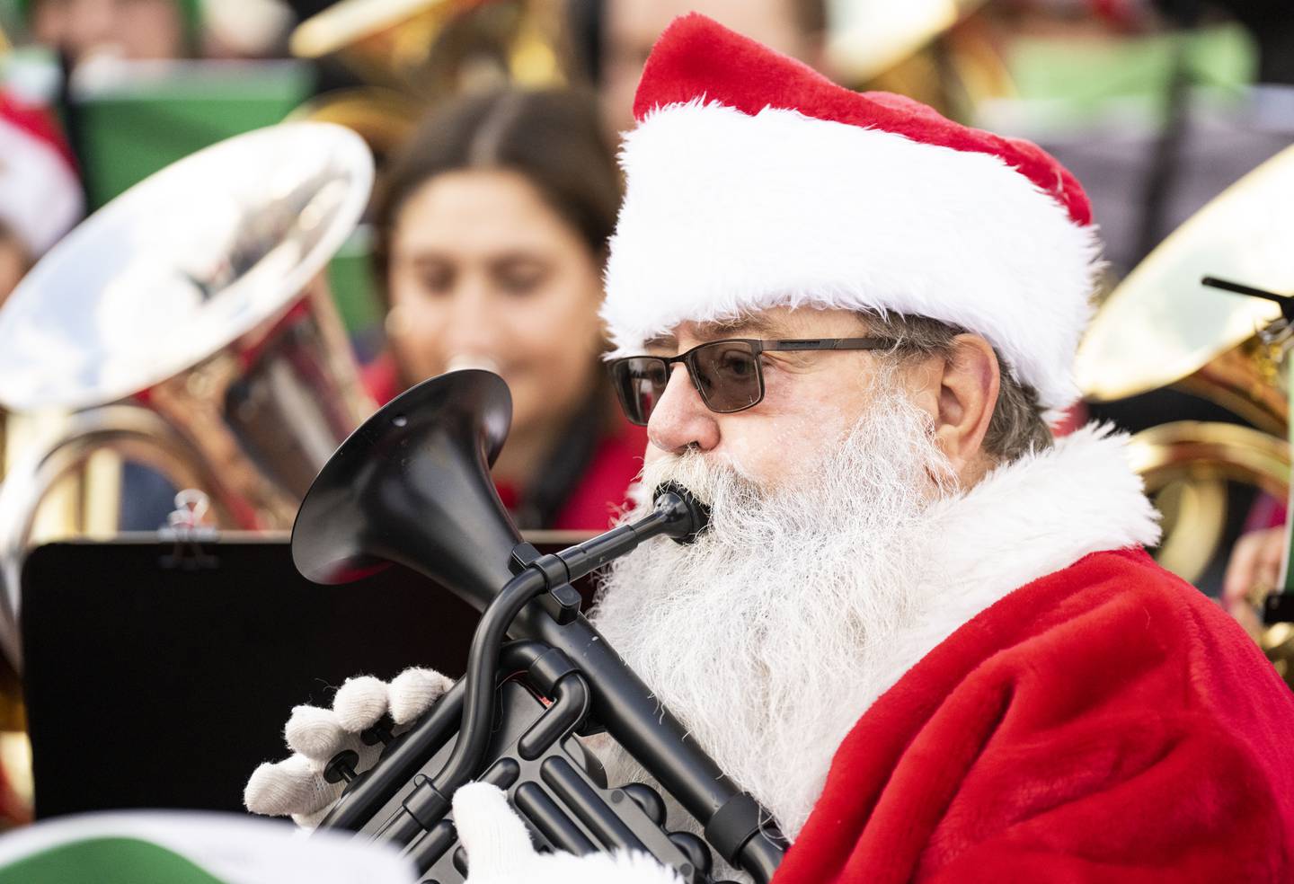 Richard Spittel, of Baltimore, performs with other musicians through a piece of music during the 37th TubaChristmas at the Inner Harbor Amphitheater, in Baltimore, Saturday, December 17, 2022