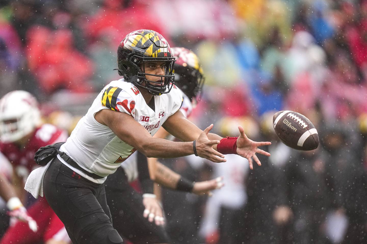 Maryland quarterback Taulia Tagovailoa (3) pitches the ball off during the first half of an NCAA college football game against Wisconsin Saturday, Nov. 5, 2022, in Madison, Wis.