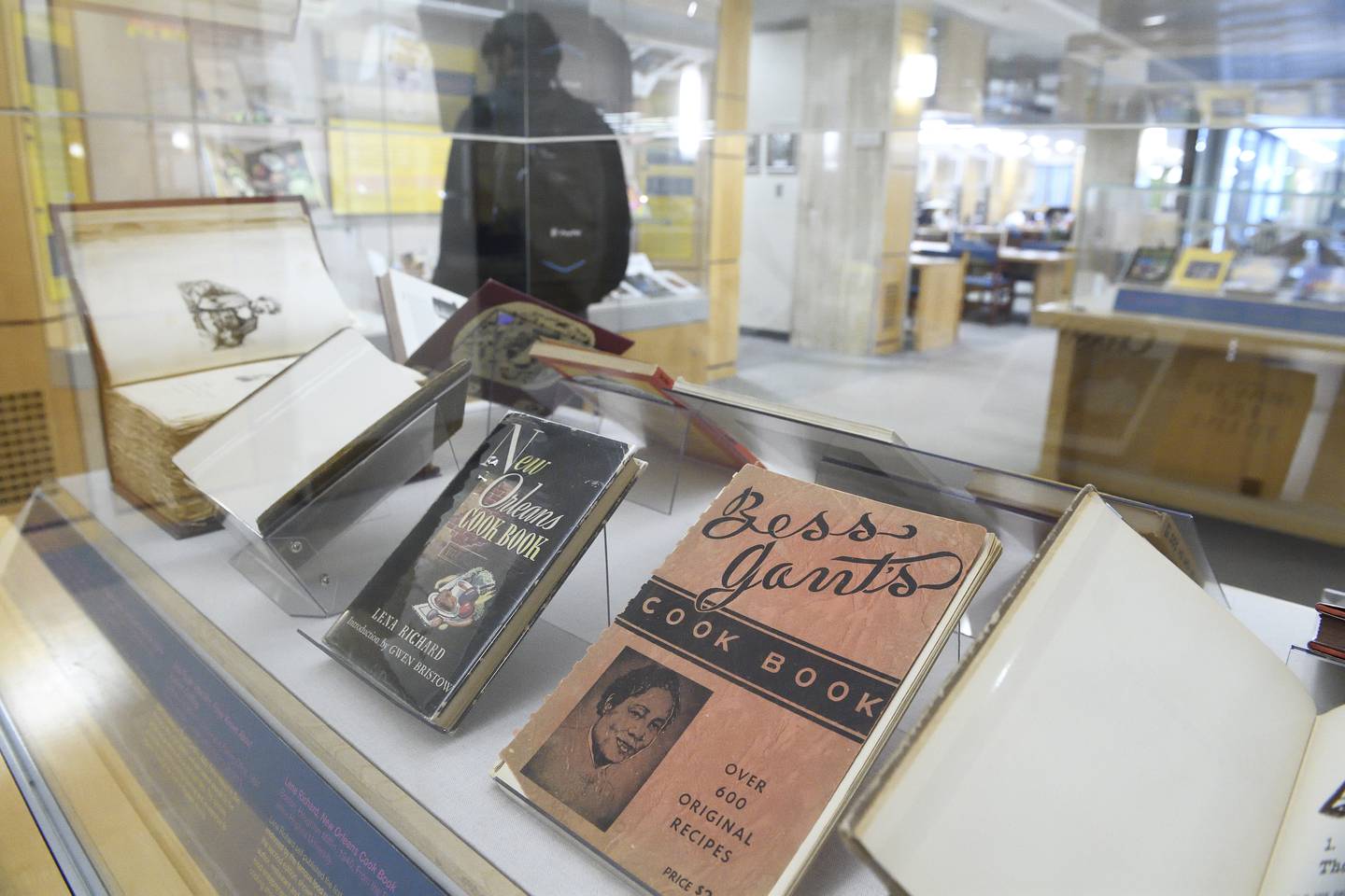 Cookbooks from the collections of Toni Tipton-Martin and W. Paul Coates are on display at Johns Hopkins Eisenhower Library.
