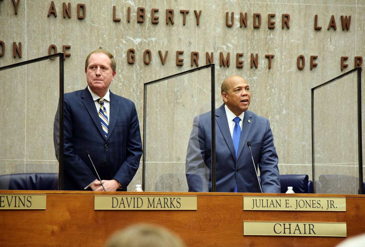 Baltimore County Councilman David Marks, a Republican, and Democratic council chair Julian Jones stand in the County Council chambers before a budget announcement in April 2022.