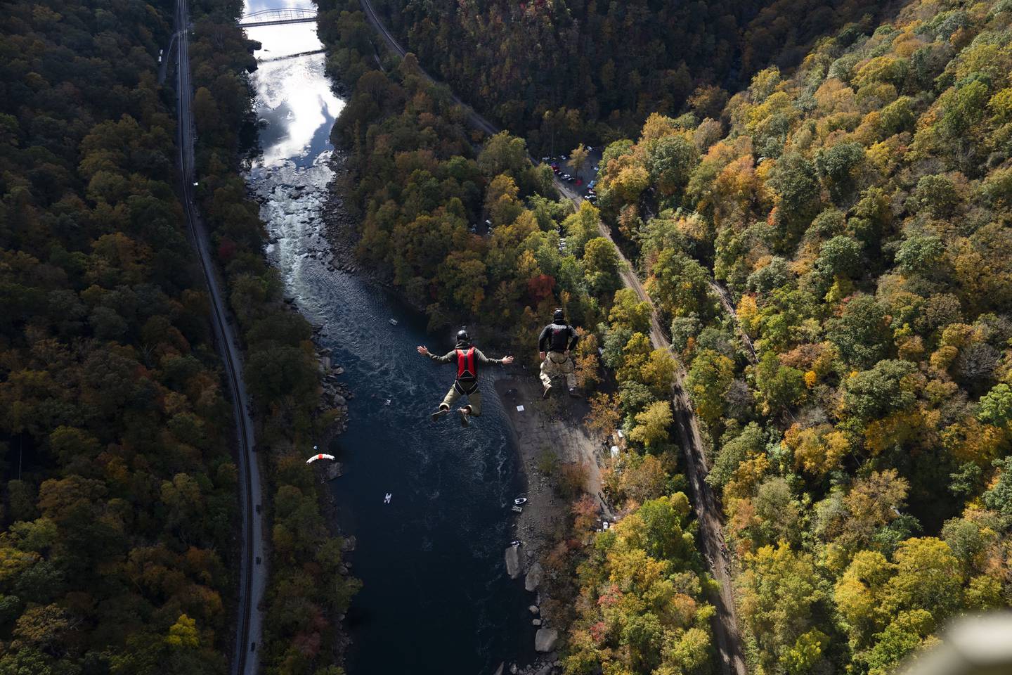 People from all over the world base jump off of the bridge during Bridge Day, an annual celebration of the famous New River Gorge Bridge in West Virginia. The bridge is currently the longest single-span steel arch bridge in the United States and the third highest bridge in the country.