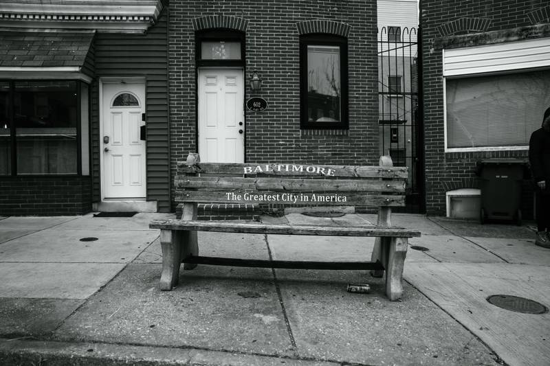 A bench boasting the city slogan "Baltimore - The Greatest City in America" in South Baltimore.