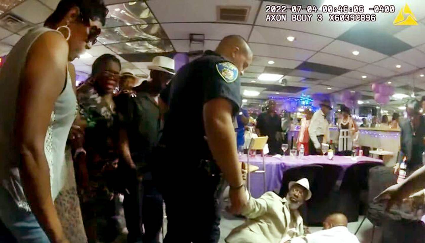Police body cam photo of Lloyd Muldrow, center on the floor, defended a friend without pulling his handgun. Now he’s on probation in Baltimore.