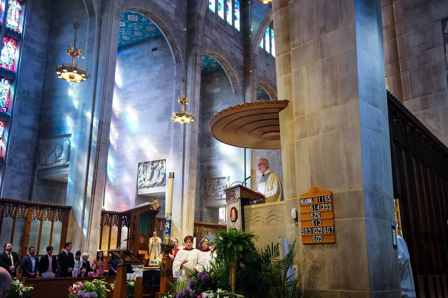 Archbishop Emeritus of Baltimore, Cardinal Edwin F. O'Brien, reads scripture with the congregation at the Cathedral of Mary Our Queen, in Baltimore, MD., on Easter Sunday, April 9, 2023.
