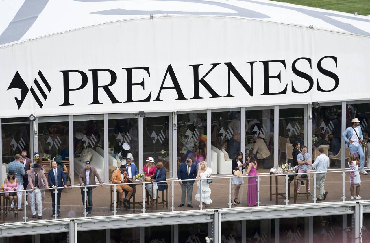 Fans watch before National Treasure, #1, ridden by jockey John Velazquez, wins the Preakness Stakes on Preakness Day at Pimlico Race Course in Baltimore, Maryland on May 20, 2023.