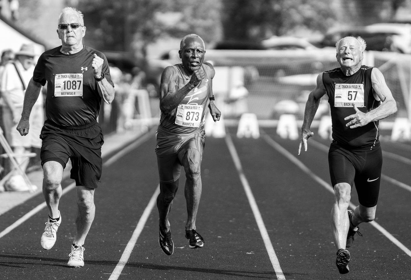 Paul Milewski of Wisconsin,  Robert Koontz, 79, of Waldorf MD, and William Bach of South Carolina, compete in the 100-meter at South Fayette High School, in McDonald, PA, during the National Senior Games, Wednesday, July 12, 2023.