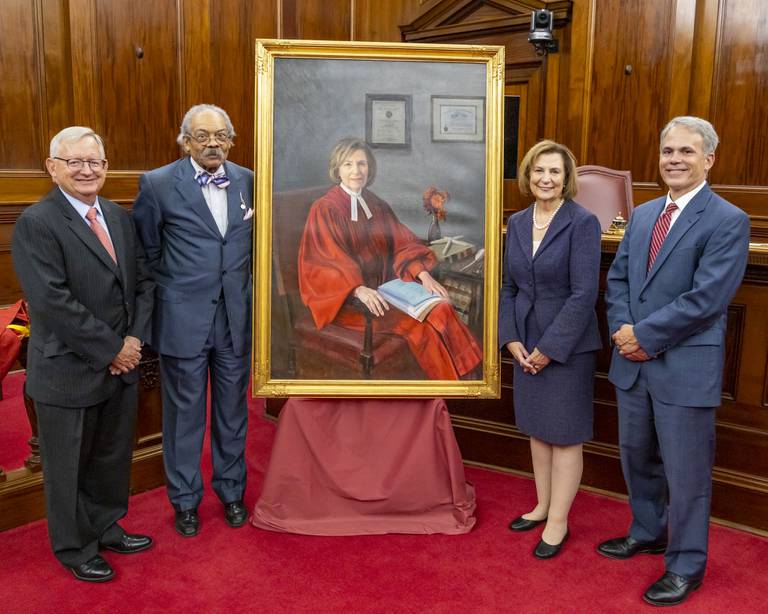A portrait of retired Maryland Court of Appeals Chief Judge Mary Ellen Barbera is dedicated during a ceremony in Annapolis on Thursday, Sept. 22, 2022. Standing with the portrait are, from left: retired Chief Judge Joseph M. Getty, retired Chief Judge Robert M. Bell; Barbera; current Chief Judge Matthew J. Fader. The portrait was painted by Diana "Danni" Dawson and cost $25,000. Photo courtesy of the Maryland Judiciary.