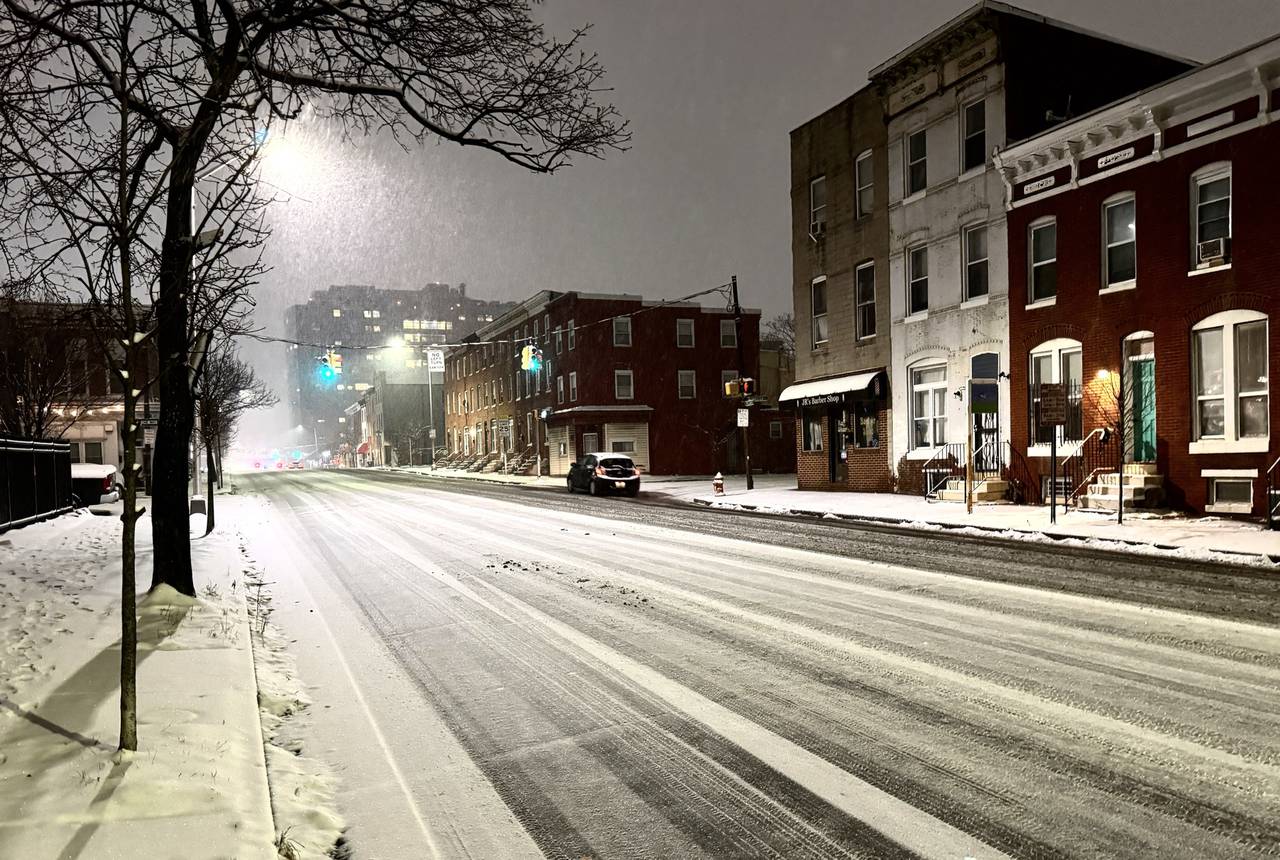 Snow falls in Upper Fells Point on Monday, January 15, 2023.