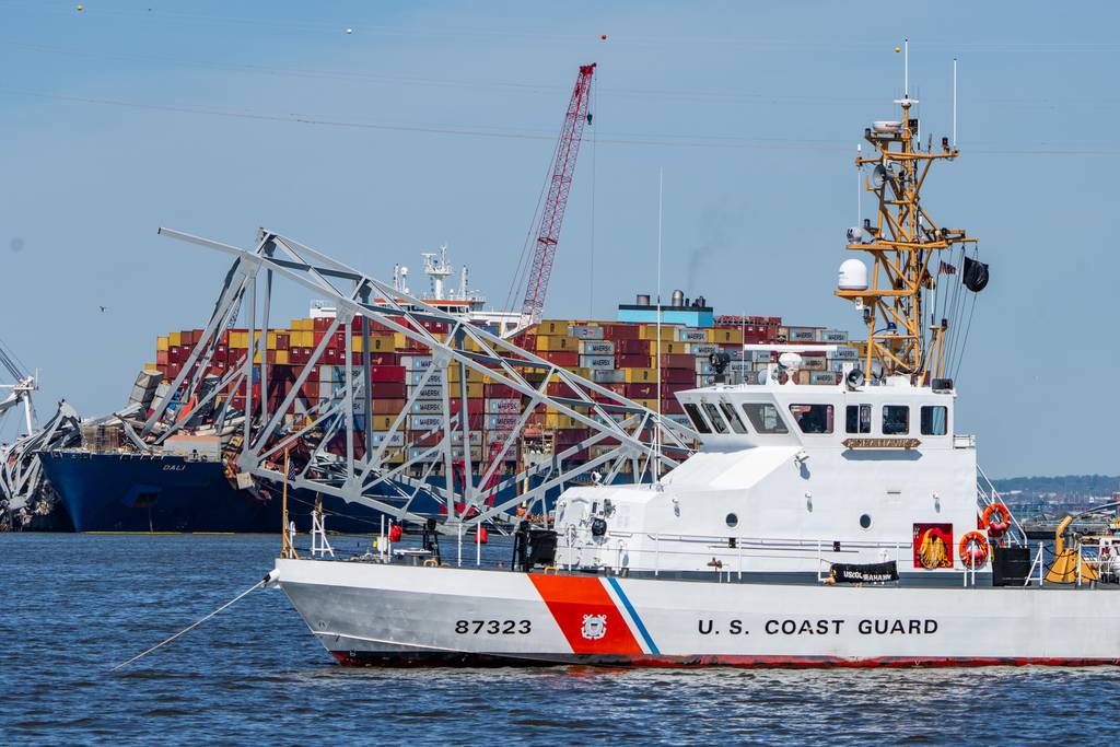 A U.S. Coast Guard boat is seen in front of the Dali and Key Bridge wreckage on Tuesday, April 16, 2024.