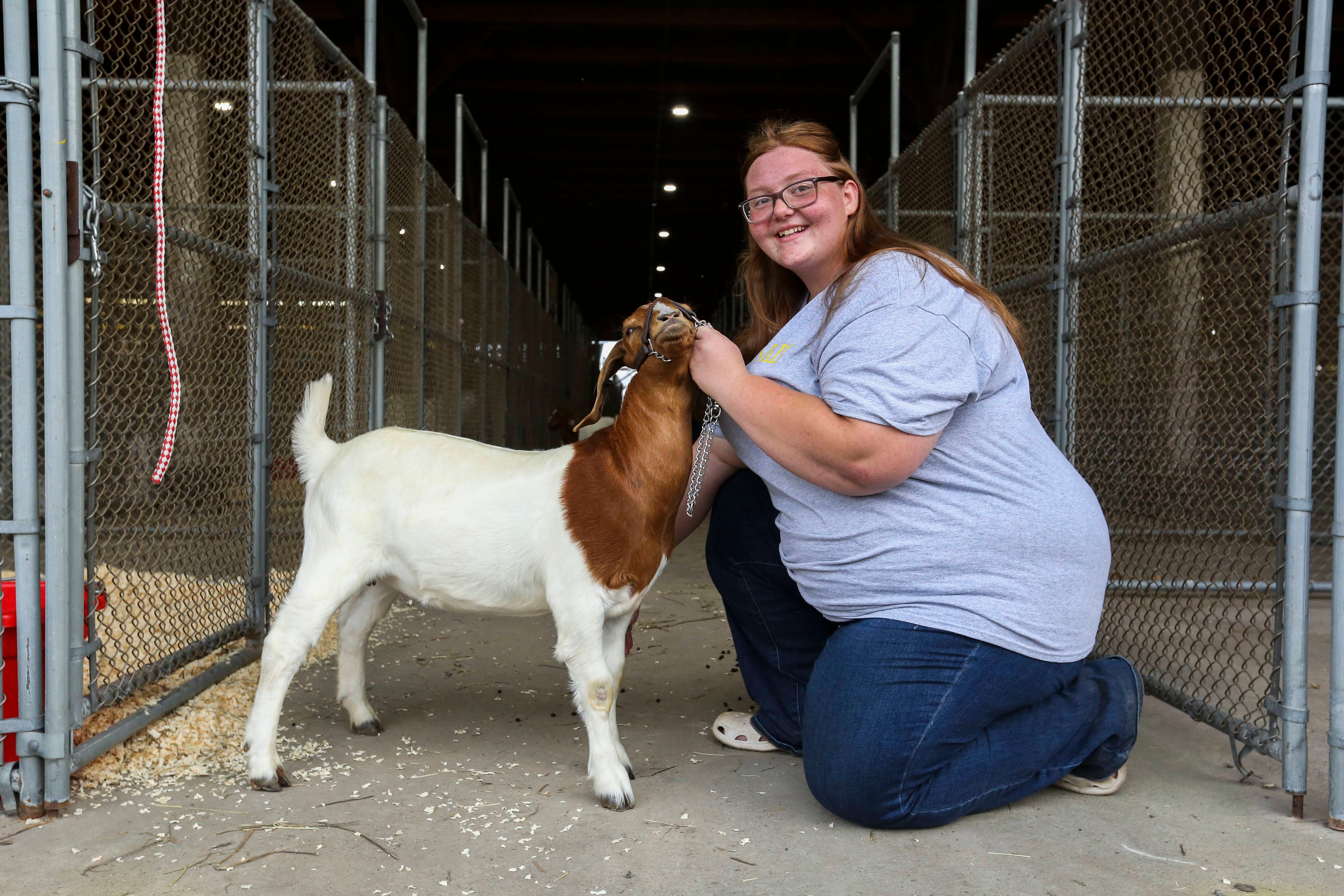 Alivia Blum shows off her goat, Miss Kitty, at the Maryland State Fair in Timonium, MD on August 25, 2022.