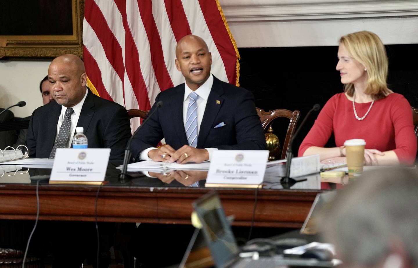 Governor Wes Moore, center, Treasurer Dereck Davis, left, and Comptroller Brooke Lierman, right, have the first annual meeting of the Maryland Board of Public Works at the Maryland State House on January 25, 2023.