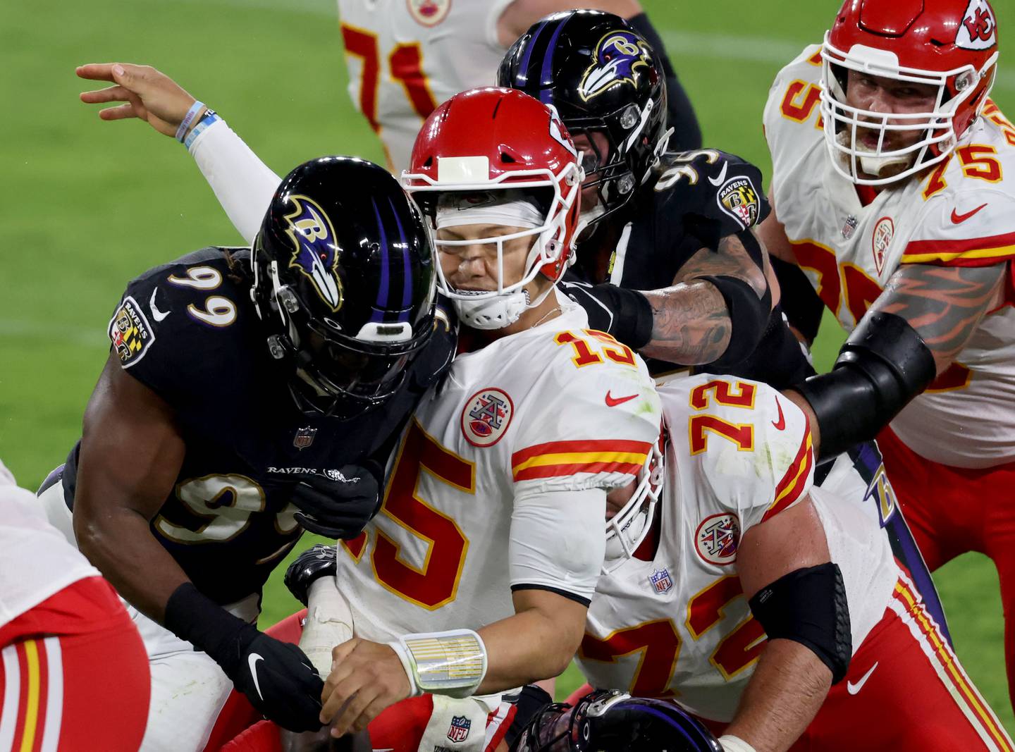 BALTIMORE, MARYLAND - SEPTEMBER 28: Patrick Mahomes #15 of the Kansas City Chiefs is tackled by Matt Judon #99 and Derek Wolfe #95 of the Baltimore Ravens at M&T Bank Stadium on September 28, 2020 in Baltimore, Maryland.