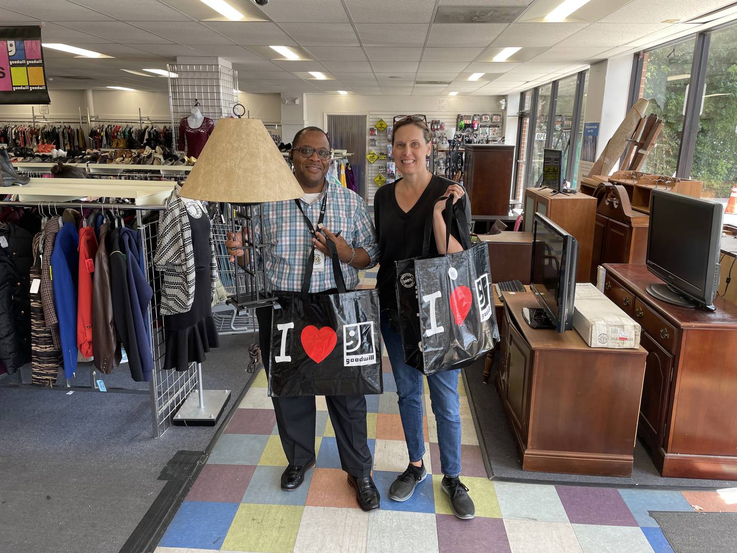 Work colleagues Uhmar Alston and Brenda Wintrode discovered they both love treasure hunting at thrift stores. Alston, an executive assistant, and Wintrode, a state government reporter at The Baltimore Banner are pictured here with their purchases at the Goodwill Retail Store at 6999 Reisterstown Rd. in Baltimore on August 26, 2022.