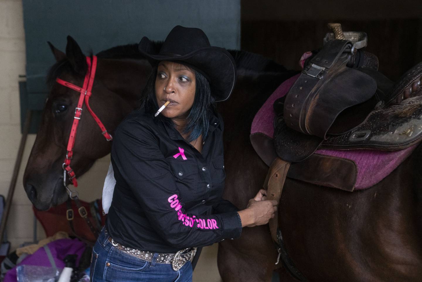 Leslie DeLacy prepares her horse before competing in the Bill Pickett Invitational Rodeo, at the Show Place Arena, in Upper Marlboro, MD, Saturday, September 23, 2023.