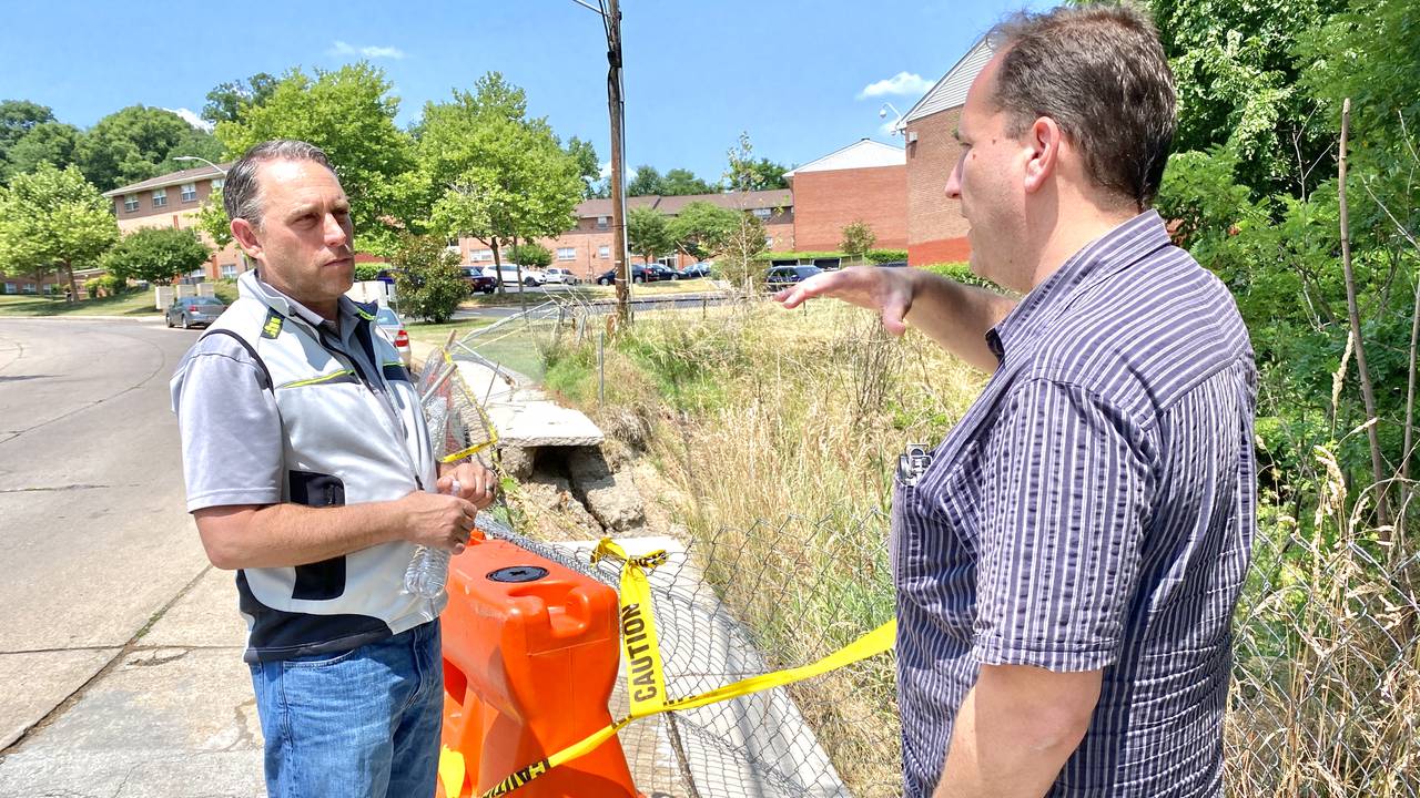 Brad Rogers (right), executive director of the South Baltimore Gateway Partnership, discusses resiliency features with the group's consultant, Brett Berkley of GreenVest, on June 15, 2023.