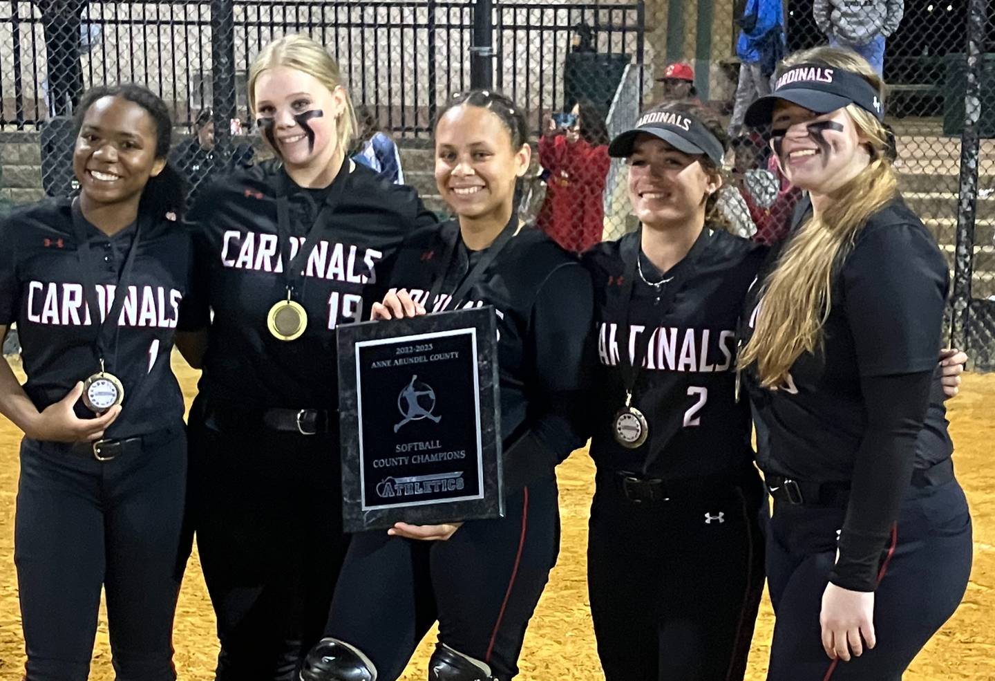 Crofton softball captains pose with the Anne Arundel County championship plaque. The No. 3 Cardinals won their first title with a 10-1 victory over Northeast at Bachman Park.