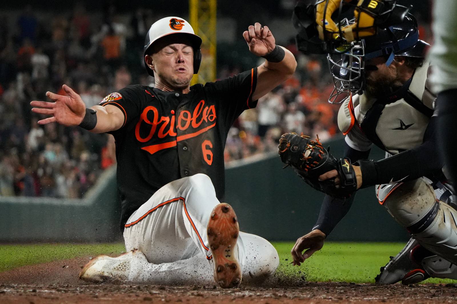 Baltimore Orioles first baseman Ryan Mountcastle (6) slides home safely for a walk-off win against the Detroit Tigers at Camden Yards on Friday, April 21. The Orioles beat the Tigers, 2-1, on their way to sweeping the series.