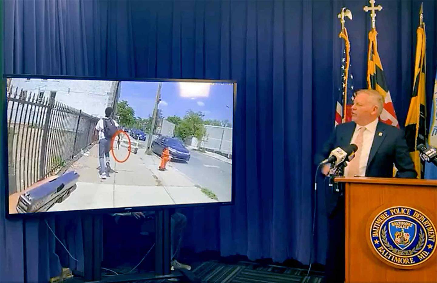 Deputy Commissioner of the Public Integrity Bureau Brian Nadeau presents body-camera footage from a police-involved shooting on Thursday.