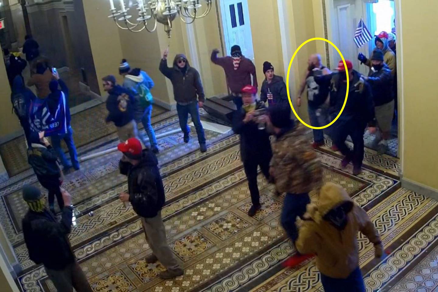 This image from U.S. Capitol Police security video and contained in the government's sentencing memorandum for Joshua Pruitt, circled in yellow by source, shows him entering the U.S. Capitol on Jan. 6, 2021, in Washington. Pruitt, a Maryland man affiliated with the far-right Proud Boys extremist group, has been sentenced to more than four years in prison for storming the U.S. Capitol. (Department of Justice via AP)