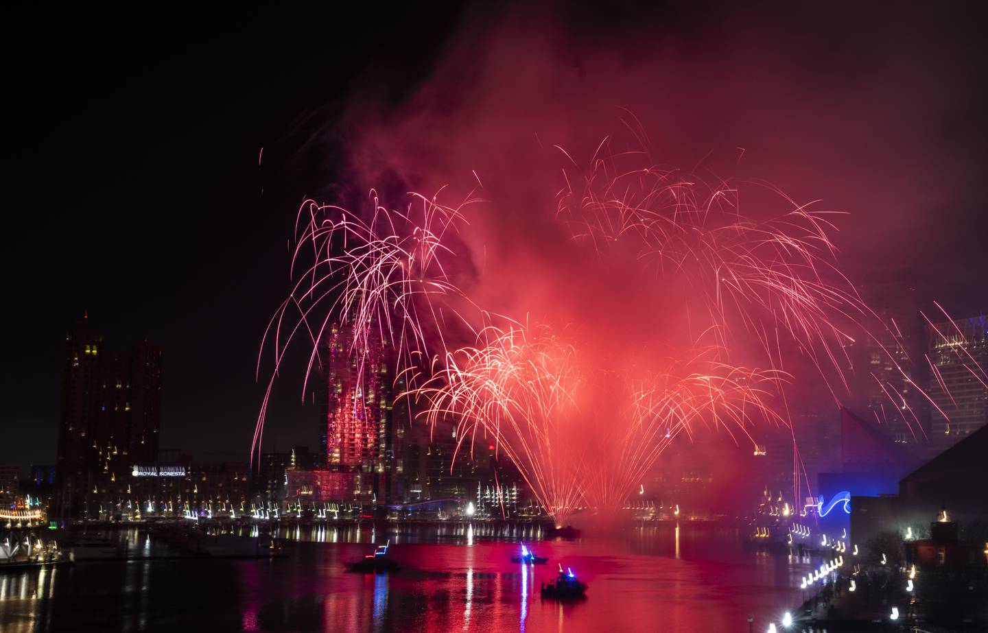 Fireworks shoot off into the sky to celebrate the New Year, seen from the fourth-floor terrace of the Four Seasons Hotel Baltimore, Sunday, January 1, 2023.
