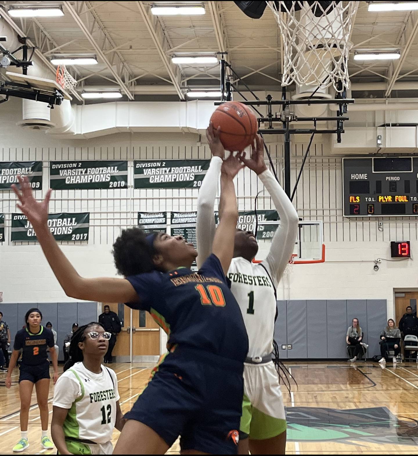 Poly's Trinity Massenburg battles Forest Park's Aliyah Carroll during the first half of Tuesday's Baltimore City girls basketball game.
