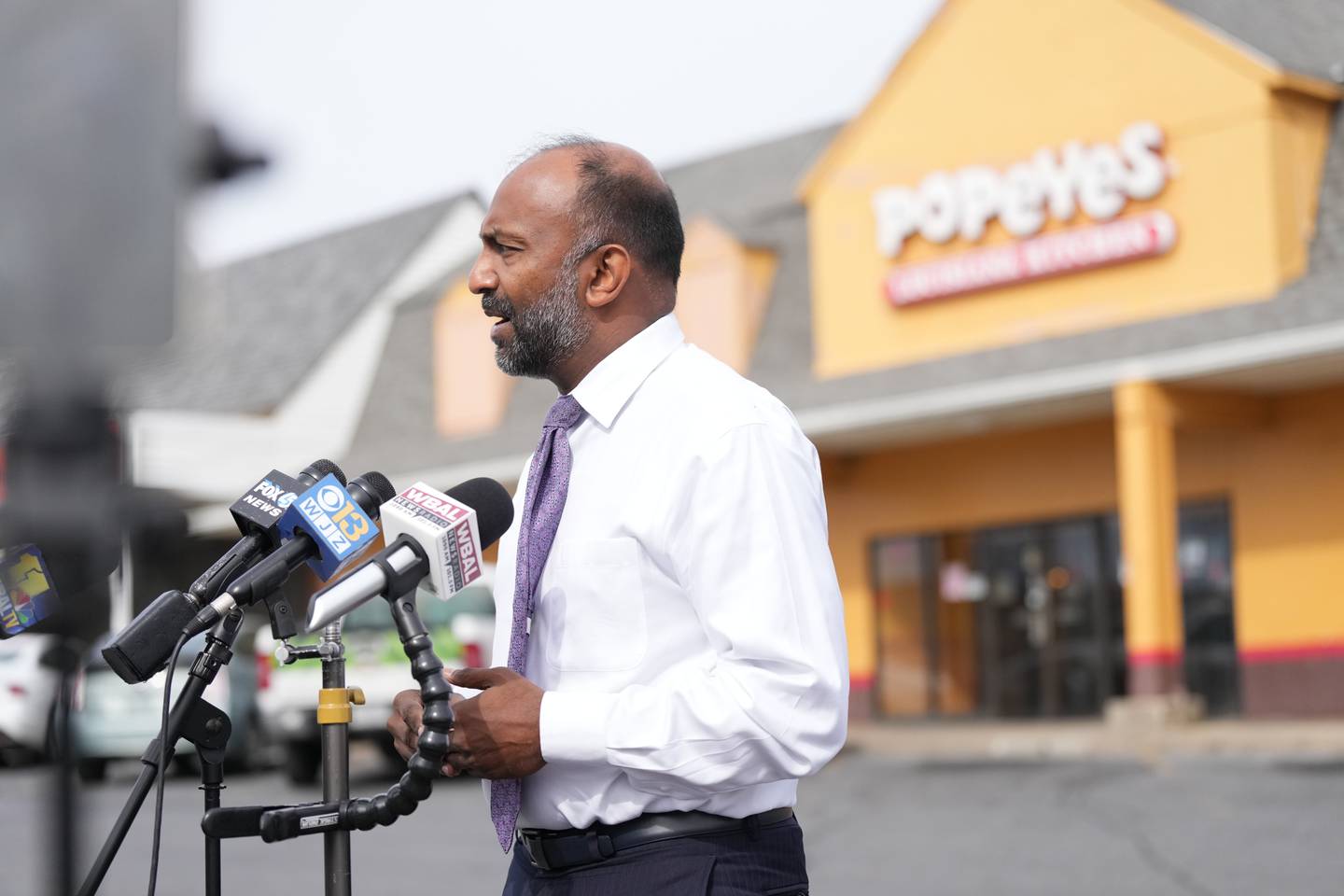 Attorney Thiru Vignarajah speaks at a press conference on Feb. 20 at Edmondson Village Shopping Center after the family of slain teen Deanta Dorsey was targeted in a shooting.