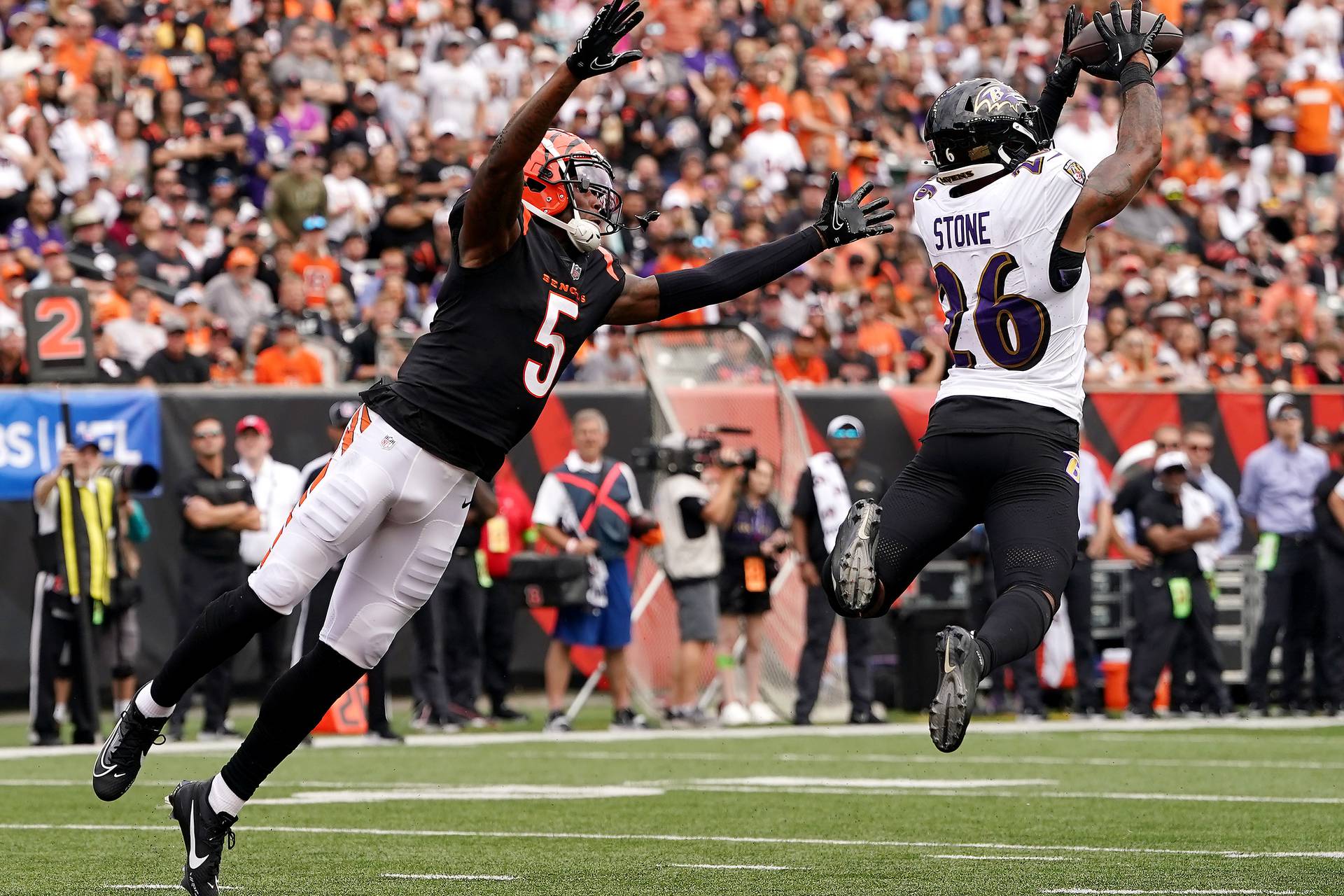 CINCINNATI, OHIO - SEPTEMBER 17: Geno Stone #26 of the Baltimore Ravens intercepts a pass intended for Tee Higgins #5 of the Cincinnati Bengals during the third quarter at Paycor Stadium on September 17, 2023 in Cincinnati, Ohio. (Photo by Dylan Buell/Getty Images)