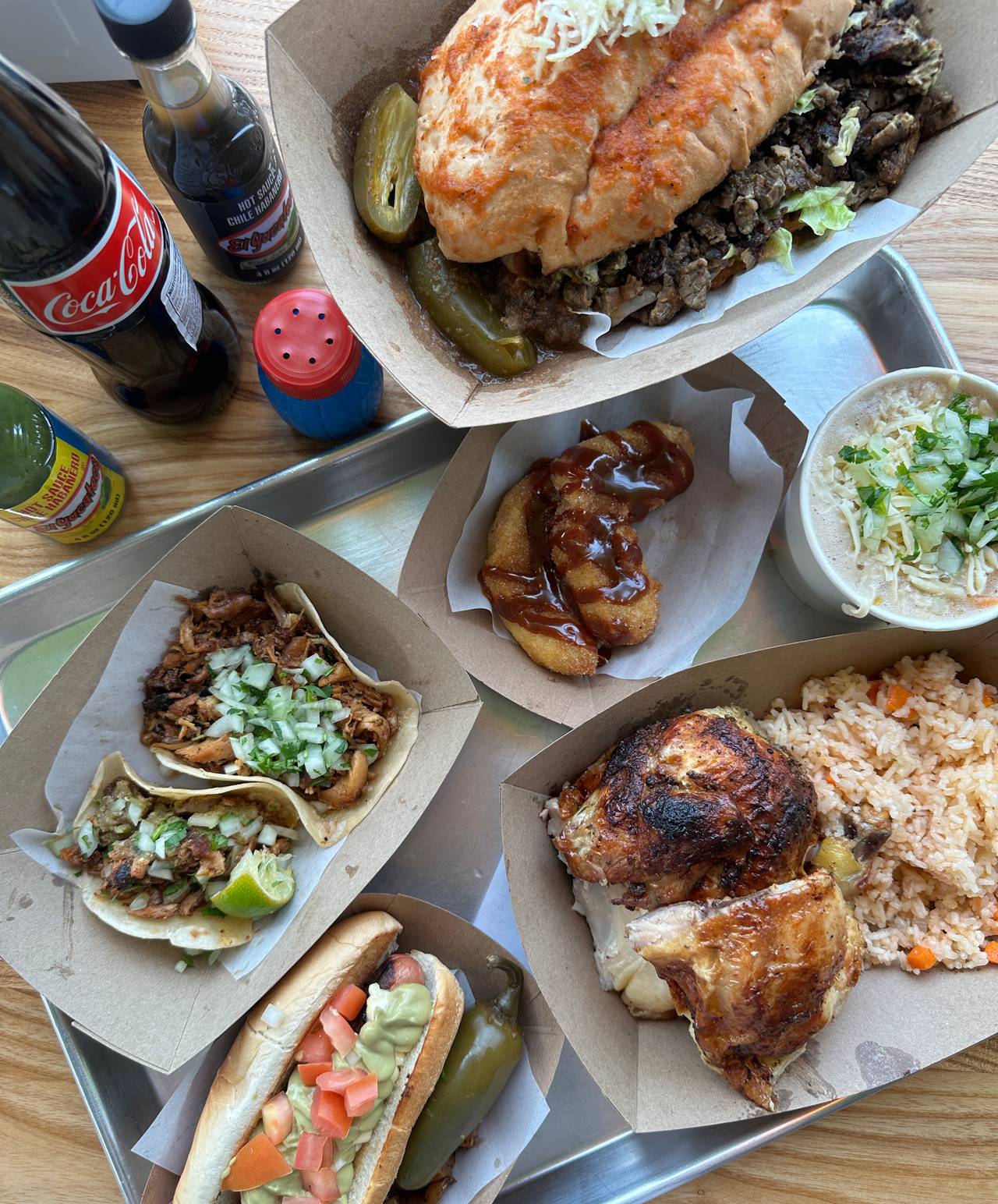 Clockwise from top: a torta, churros, rotisserie chicken, hot dog and tacos from Nana.