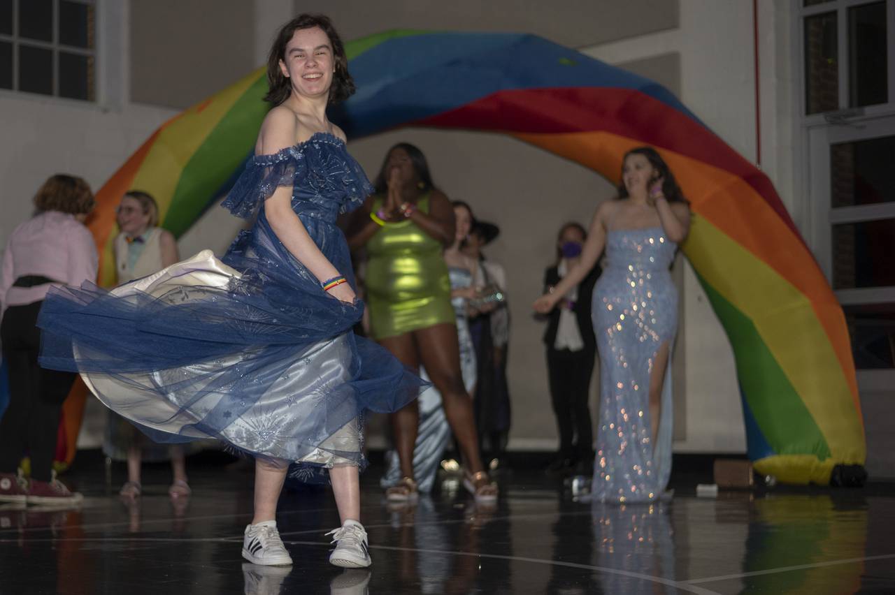 Axyl Fien, 15, spins around the dance floor during Pride Prom at the Harriet Tubman Cultural Center in Columbia, MD on June 10, 2023.