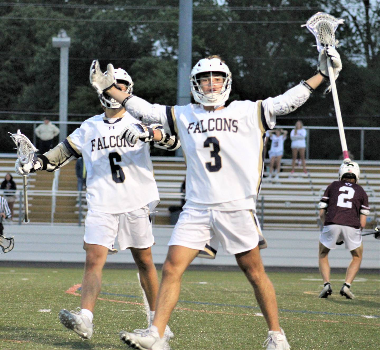 Severna Park sophomore Jack Fish (3) celebrates with teammate Alex Stroble after scoring his third goal of the game during the fourth period of Wednesday's Class 3A state boys lacrosse quarterfinal match with Towson. The No. 11 and defending state champ Falcons rallied for an 8-5 victory over the Generals to advance this weekend's state semifinals.