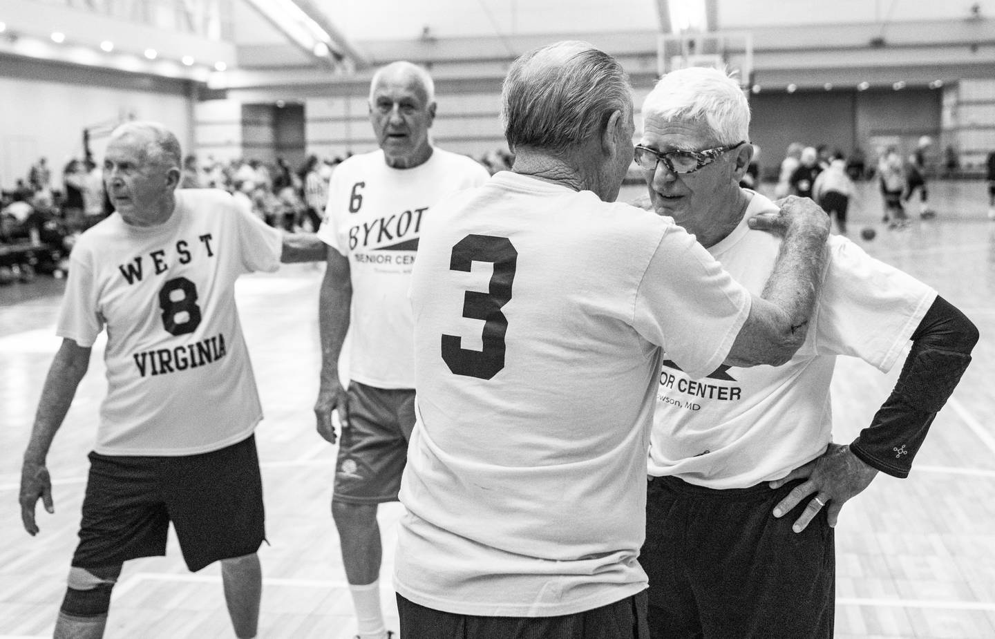 Bykota Tigers are consoled by the West Virginia Generals after their basketball game at the David L. Lawrence Convention Center, in Pittsburgh, during the National Senior Games, Wednesday, July 12, 2023.