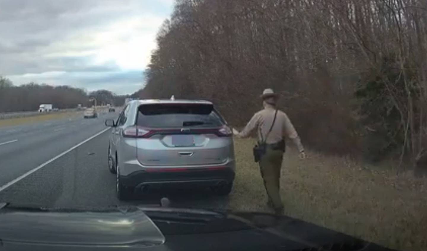A Maryland State Police trooper approaches acting Superintendent  Dalaine M. Brady's SUV on Interstate 95. The traffic stop lasted eight seconds.