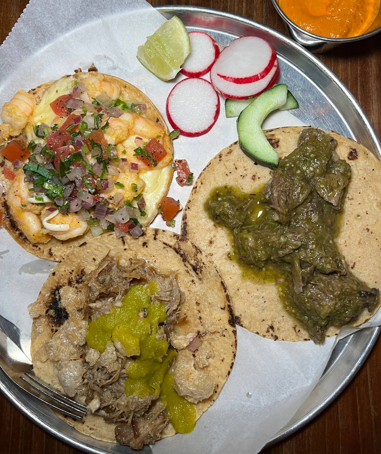 Clockwise from top left, the al gobernador, carnitas con salsa verde and lengua tacos from Clavel.
