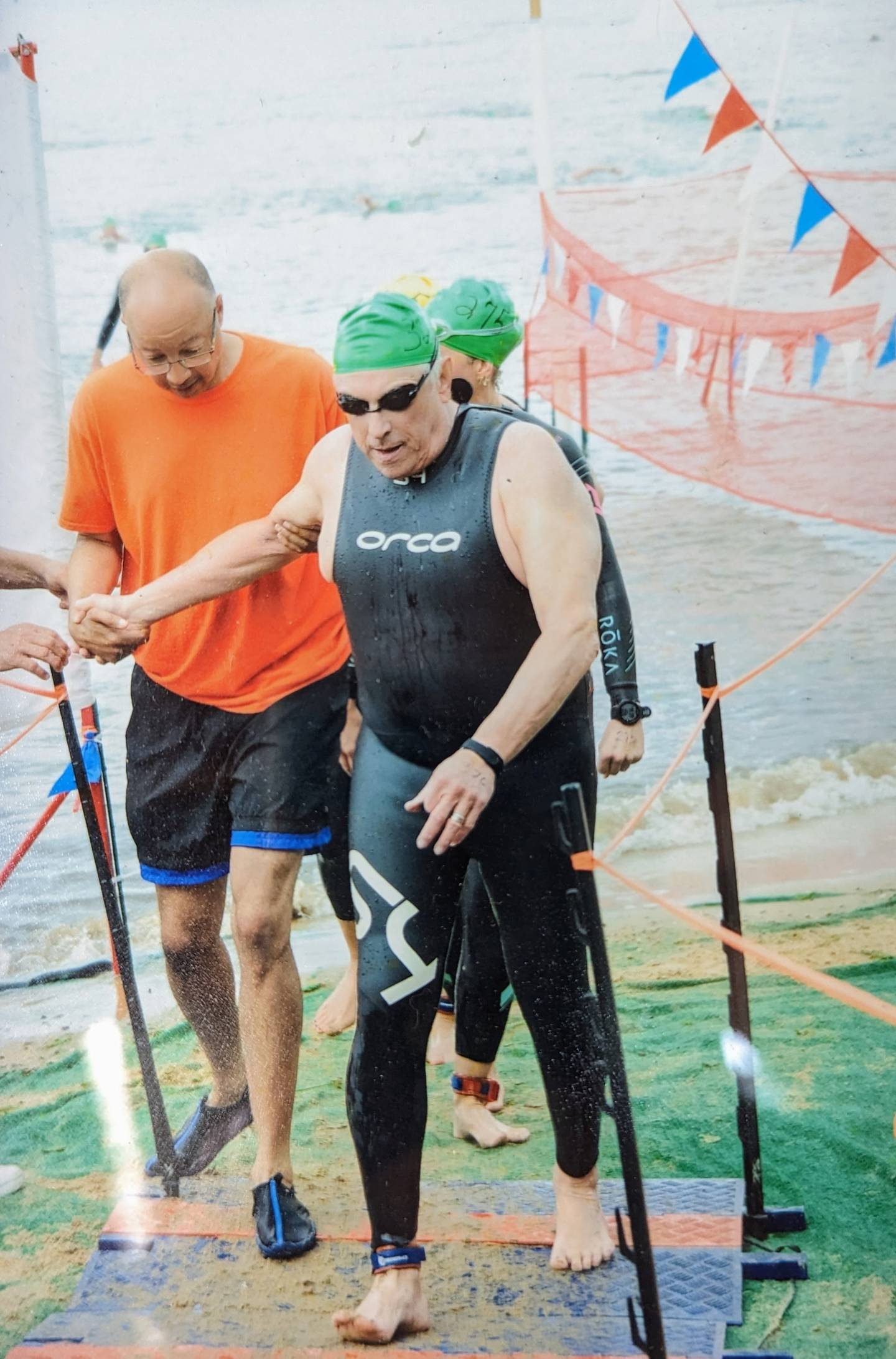 Martin Wasserman emerging from the water during last year's Great Chesapeake Bay Swim. He was the oldest swimmer to finish and this year will be the oldest swimmer to take off Sunday from Sandy Point.