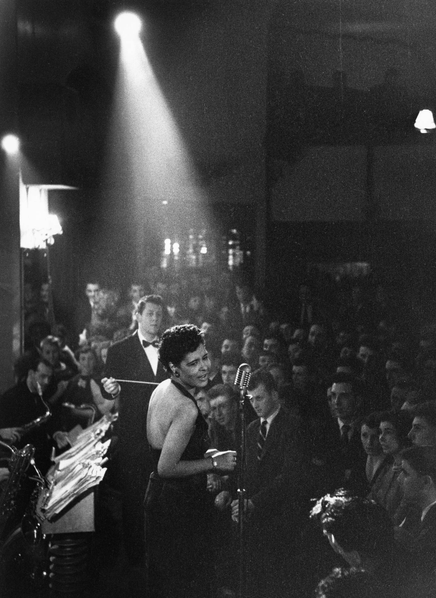 American jazz singer Billie Holiday (1915 - 1959) in the spotlight during a performance.  Original Publication: Picture Post - 7380 - Billie Holiday -  (Photo by Charles Hewitt/Getty Images)