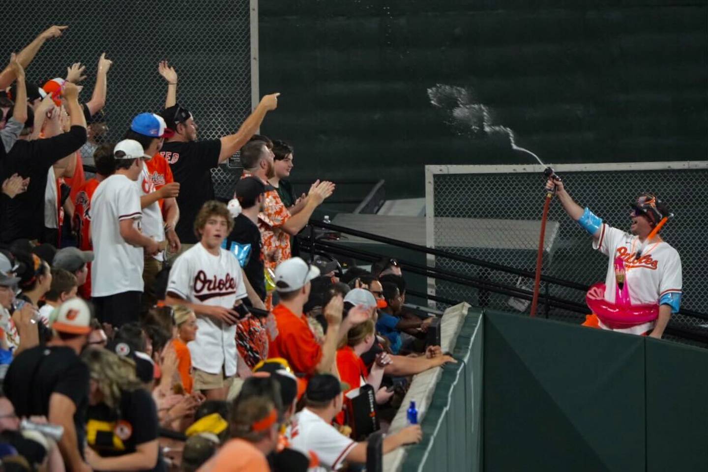 “Mr. Splash” soaks Orioles fans with a garden hose in the Bird Bath section the team debuted Friday night against the Pirates. Fans in this section will get splashed every time the Orioles double, triple, homer or score a run.