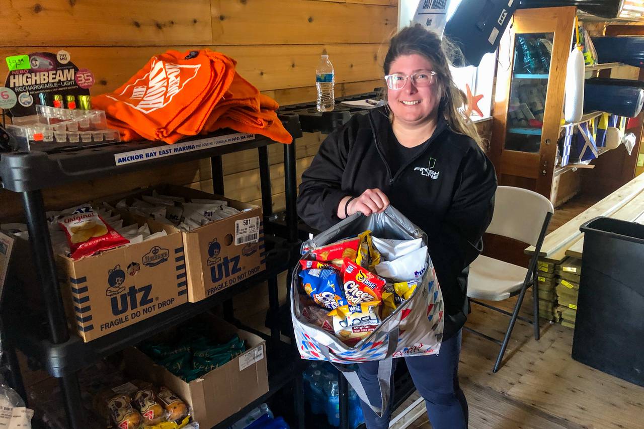 Melanie Seymour, minority owner of the Hard Yacht Cafe and Anchor Bay East Marina, shows snack bags packed for first responders that use the marina as a pit stop in Dundalk on Friday, March 29, 2024.