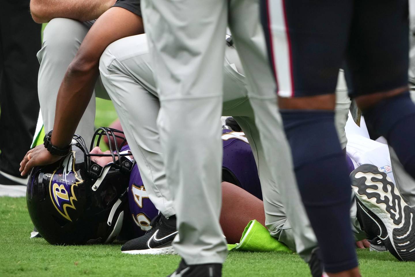 Baltimore Ravens center Tyler Linderbaum is injured on a play in the fourth quarter against the Houston Texans at M&T Bank Stadium.