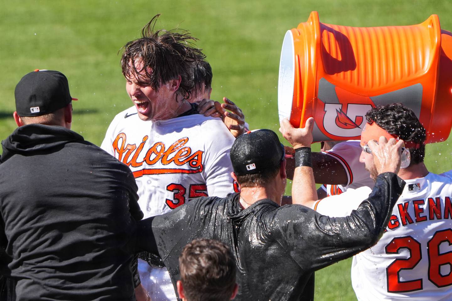 Baltimore Orioles catcher Adley Rutschman (35) gets a gatorade shower from teammates after hitting a walk-off homer agains the Oakland Athletics to win the series at Camden Yards on Wednesday, April 12.