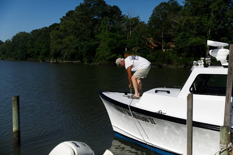 JC Hudgins prepares to go out on his boat to check his crab pots for abundance in Mathews, Va., on Friday, June 10, 2022.