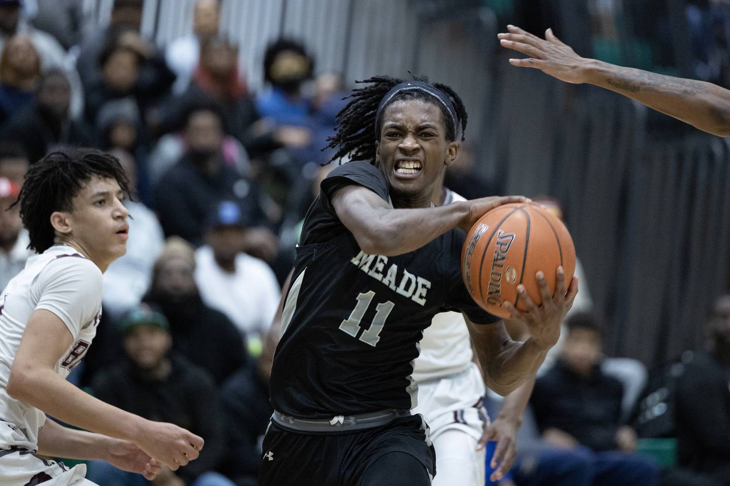 Meade’s Xavion Roberson (11) drives the ball down court during the Anne Arundel County Boys Basketball Championship game in Odenton, Md., on Saturday, February 18, 2023.  Meade defeated Broadneck 60-51 in regulation time to win the championship.